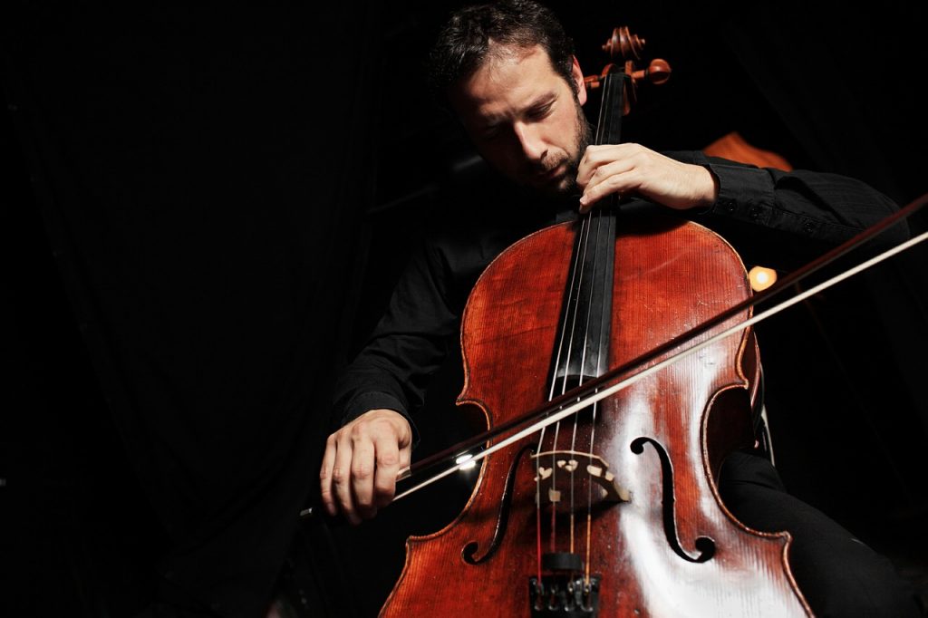 adult playing cello